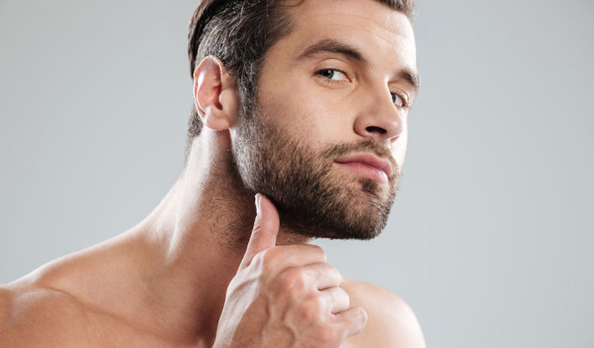 man rubbing beard man rubbing beard